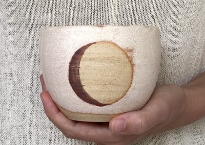 White pottery moon cup
